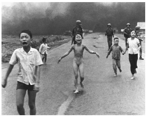 Terrified children run from their village after a U.S. napalm attack during the Vietnamese War. This photograph was pivotal in promoting awareness of the suffering of the Vietnamese people during the war and was particularly effective in arguments against the use of napalm. AP/WIDE WORLD PHOTOS.