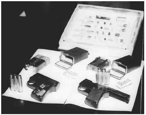 Concealed weapons that fell into western hands through the defection of Russian Intelligence Captain Nikolai E. Khokhlov in 1954 included cases of cigarettes that fired hollowpoint bullets and miniature pistols that fired while making a sound less than the snap of a finger. AP/WIDE WORLD PHOTOS.