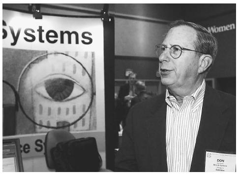 The Society of Competitive Intelligence Professionals convened in Seattle in 2001, where representatives of data-mining services such as Don Smith, shown here, gathered to exhibit new software and explain their data-mining techniques. AP/WIDE WORLD PHOTOS.