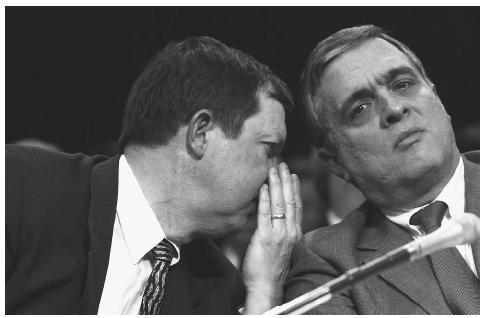 CIA director George Tenet, right, huddles with CIA Assistant Director Dale Watson during testimony before the Senate Intelligence Committee in 2002, during which Tenet told the committee that Osama bin Laden's al-Qaeda terror group remained the most immediate threat facing the U.S. AP/WIDE WORLD PHOTOS.
