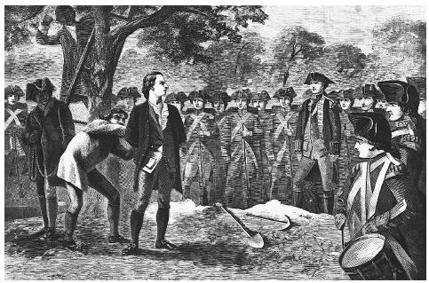 British soldiers tie the hands of Nathan Hale (1755–1776), just before his execution for spying. ©CORBIS.