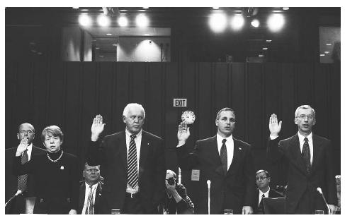 (l to r) Former U.S. Attorney Mary Jo White, former Senator Warren Rudman, former FBI director Louis Freeh, and CIA National Intelligence Officer Paul Pillar are sworn in during intelligence hearings, 2002. AP/WIDE WORLD PHOTOS.