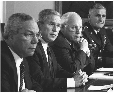 President Bush sits with his National Security Council during a meeting in the Cabinet Room of the White House, September 12, 2001. From left to right, Secretary of State Colin Powell, President Bush, Vice-President Dick Cheney, and Chairman of the Joint Chiefs of Staff General Henry Shelton. AP/WIDE WORLD PHOTOS.