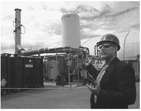 A senior research engineer at the Pacific Northwest National Laboratory conducts a tour of the napalm canister separation plant located at the Naval Weapons Station Seal Beach Detachment in 2001. After a two-year effort, the Navy disposed of more than 34,000 napalm bombs that sat for more than a quarter of a century on fields surrounding the facility. AP/WIDE WORLD PHOTOS.