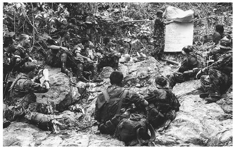 U.S. Navy SEALs join their Filipino counterparts during a 2000 joint counter-terrorism exercise in a remote Philippine village, aimed at helping Philippine forces to destroy the Islamist extremist terror group Abu Sayyaf. AP/WIDE WORLD PHOTOS.