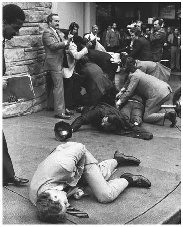 Secret Service agent Timothy J. McCarthy, foreground, lies wounded outside a Washington hotel after throwing himself in the line of fire of gunshots directed at President Ronald Reagan on March 30, 1981. Washington policeman Timothy Delahanty, center, and Press Secretary James Brady, back, were also wounded along with the president. All those pictured survived their wounds, and McCarthy later returned to duty. AP/WIDE WORLD PHOTOS.