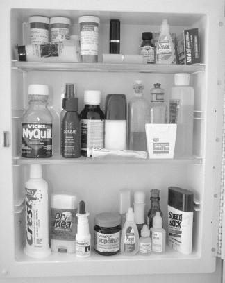 The average medicine cabinet is filled with dozens of products to keep people well, but many products can be fatal if taken accidentally or not taken as directed. (Photograph by Robert J. Huffman. Field Mark Publications. Reproduced by permission.)