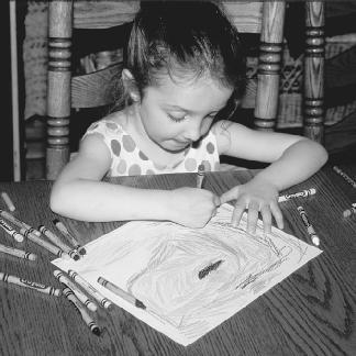 Coloring is one of the best ways for children to express their creativity. (Photograph by Robert J. Huffman. Field Mark Publications. Reproduced by permission.)