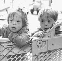 Two preschool children with Down's syndrome. (Photograph by Susan Woog Wagner. Reproduced by permission of Photo Researchers, Inc.)