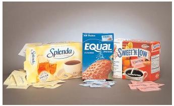 A few popular alternatives to table sugar include sucralose, aspartame, and saccharin. Despite controversy over potential health risks related to their consumption, each of these products has undergone a decade or more of scientific testing and is generally recognized as safe. [Octane Photographic. Reproduced by permission.]