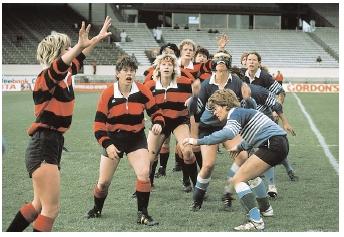 Female rugby players form a lineout, waiting for the ball to be thrown. Rugby can improve both aerobic and anaerobic fitness because, like many sports, it requires steady activity as well as frequent bursts of exertion. [© Kevin Fleming/Corbis. Reproduced by permission.]