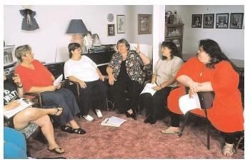 Joining a support group may help an obese person to lose weight. Losing weight can prevent a wide array of health problems that result from obesity and that generally lower the life expectancy of an obese person. [Photograph by Carolyn A. McKeone. Photo Researchers, Inc. Reproduced by permission.]