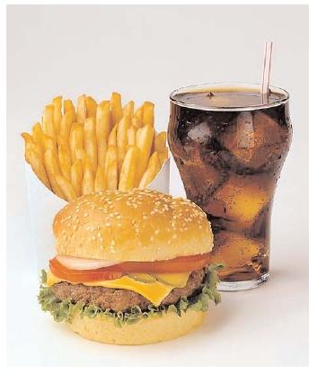 This simple meal demonstrates the complicated relationship between a culture and its food. In the twentieth century, Americans' preference for quick, portable meals popularized the fast-food burger. Over time the popularity of fast foods in America contributed to an epidemic of obesity. [Photograph by Lois Ellen Frank. Corbis/Lois Ellen Frank. Reproduced by permission.]