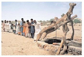 Pakistani villagers pull water from a deep well. Overpumping of groundwater has depleted the water resources of Pakistan and many other nations around the world. [© Reuters NewMedia Inc./Corbis. Reproduced by permission.]