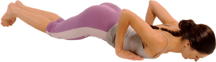 Exhale and bend your arms so that your torso touches the ground, keeping your hips elevated for a few seconds