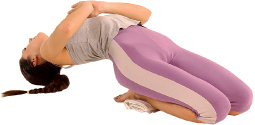 Drop your head back so that the top of your head is on the floor, but your weight should rest on your elbows. Exhale.