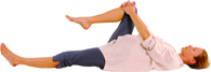 Lie on the floor on your back. With one leg stretched out, and the other with the knee to your chest.