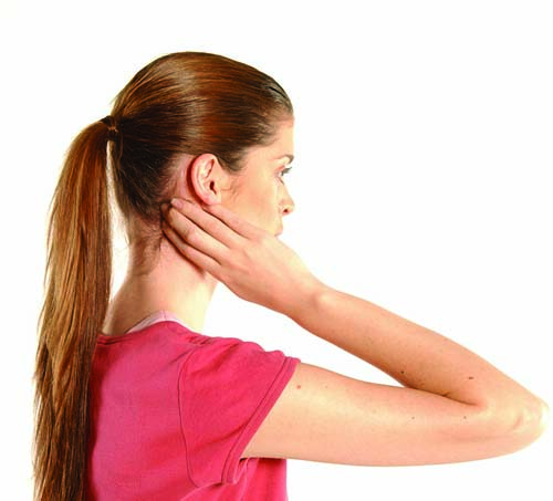 Rub your fingers over your muscle fibers at the base of your skull to loosen the muscles and tendons in the area