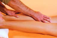 Using gentle pressure, run your palms from the feet up to the thighs of the person receiving the massage