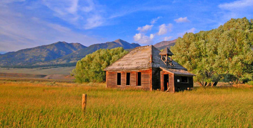 Side lighting shows off this old one room school house in Montana’s